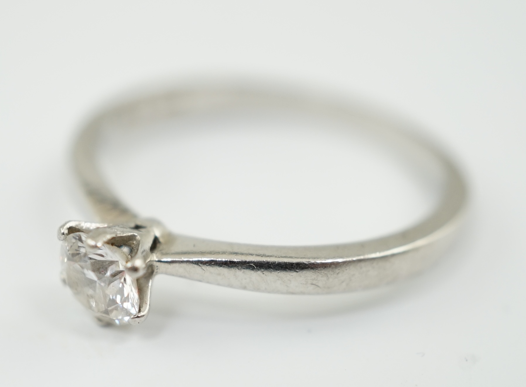 A modern platinum and solitaire diamond set ring